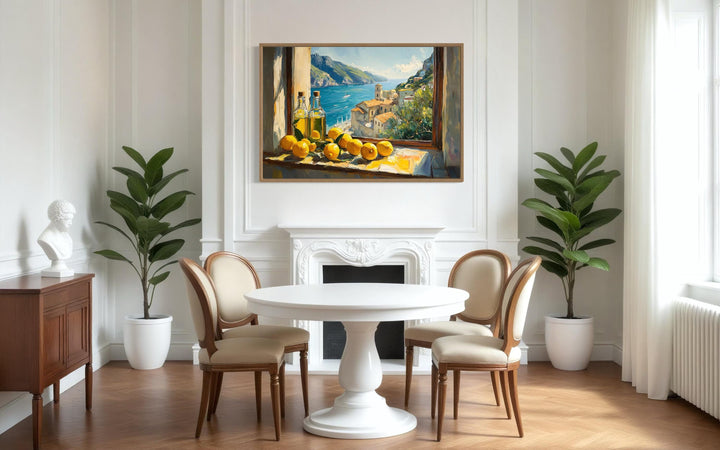 Amalfi Coast window view canvas art with lemons and olive oil above a white dining room fireplace.