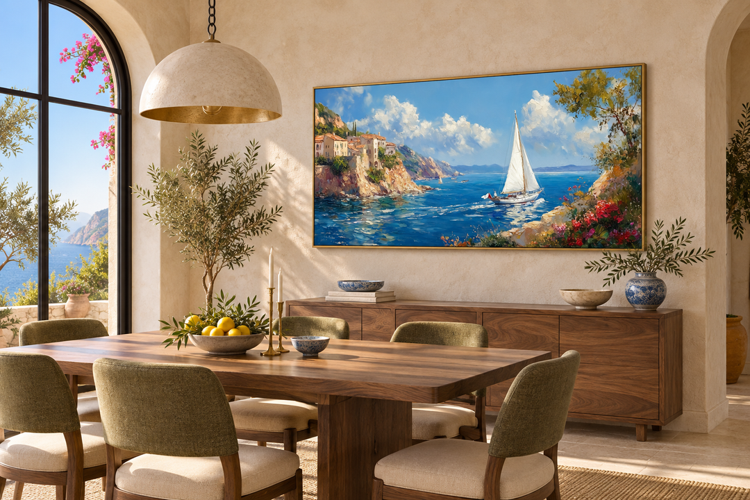 Amalfi Coast with sailboat framed canvas wall art above a wooden sideboard in a dining room.