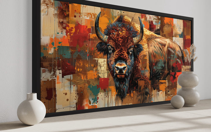 Colorful Southwestern American Bison canvas wall art in a black frame with rustic home decor.