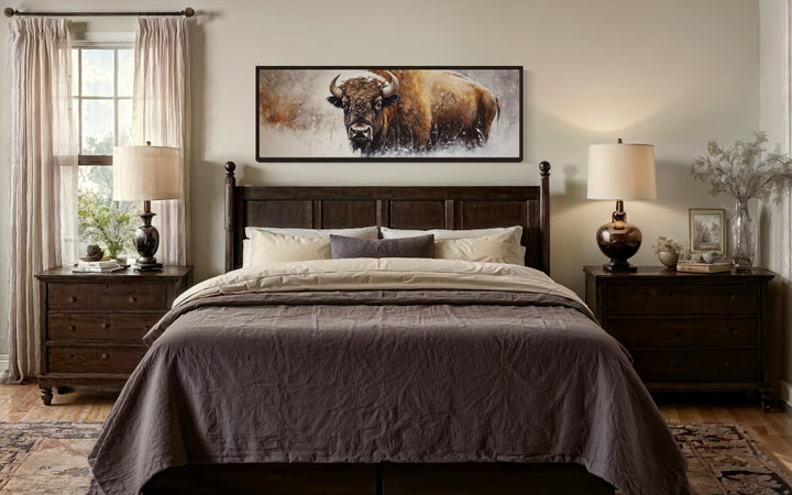 American Buffalo long horizontal framed canvas wall art hanging above a dark wood bed frame.