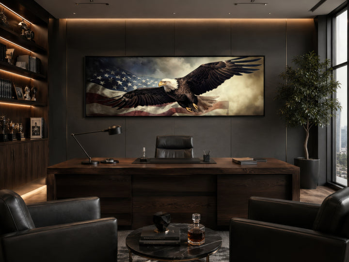 Horizontal wall art of a bald eagle flying over the American flag in a dark, modern office.