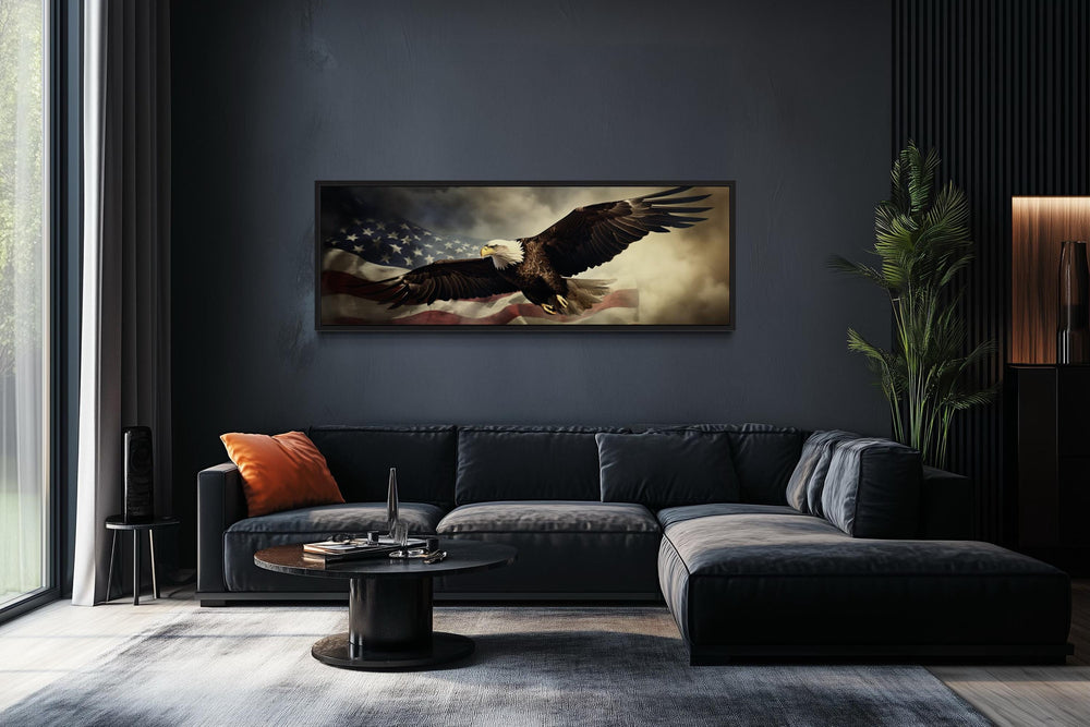Horizontal wall art of a bald eagle flying over the American flag in a dark, modern living room.