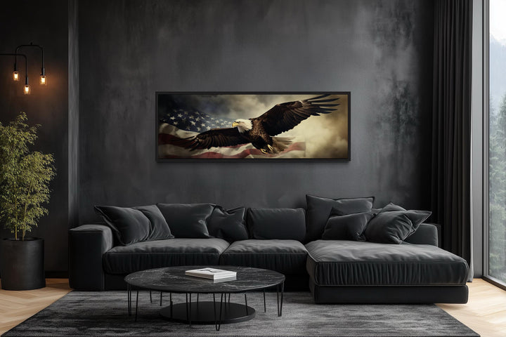 Horizontal wall art of a bald eagle flying over the American flag in a modern dark living room.