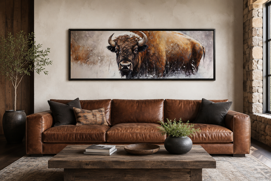American Buffalo long horizontal framed canvas wall art hanging above a brown leather sofa.