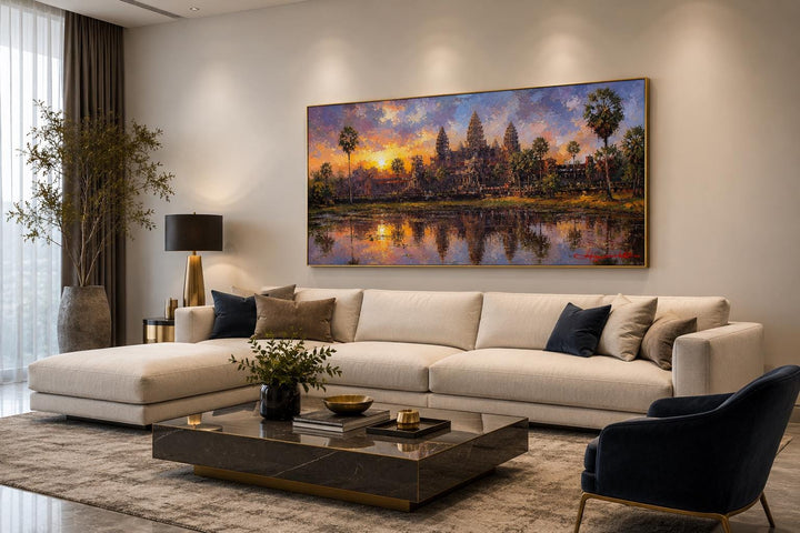 Angkor Wat sunset canvas wall art above a beige sofa in a modern living room.