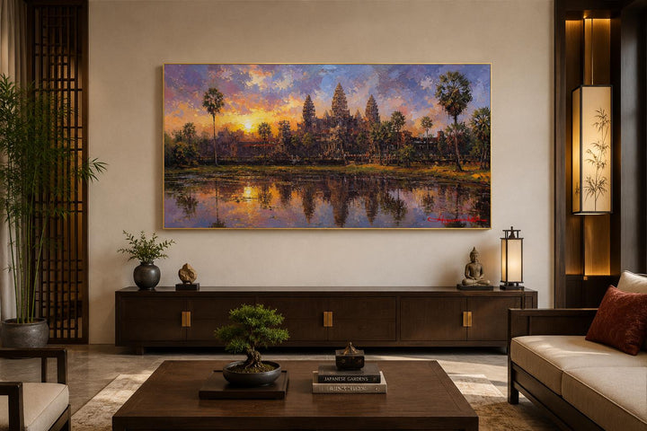 Angkor Wat sunset canvas wall art above a dark wood console in a modern Asian-style living room.