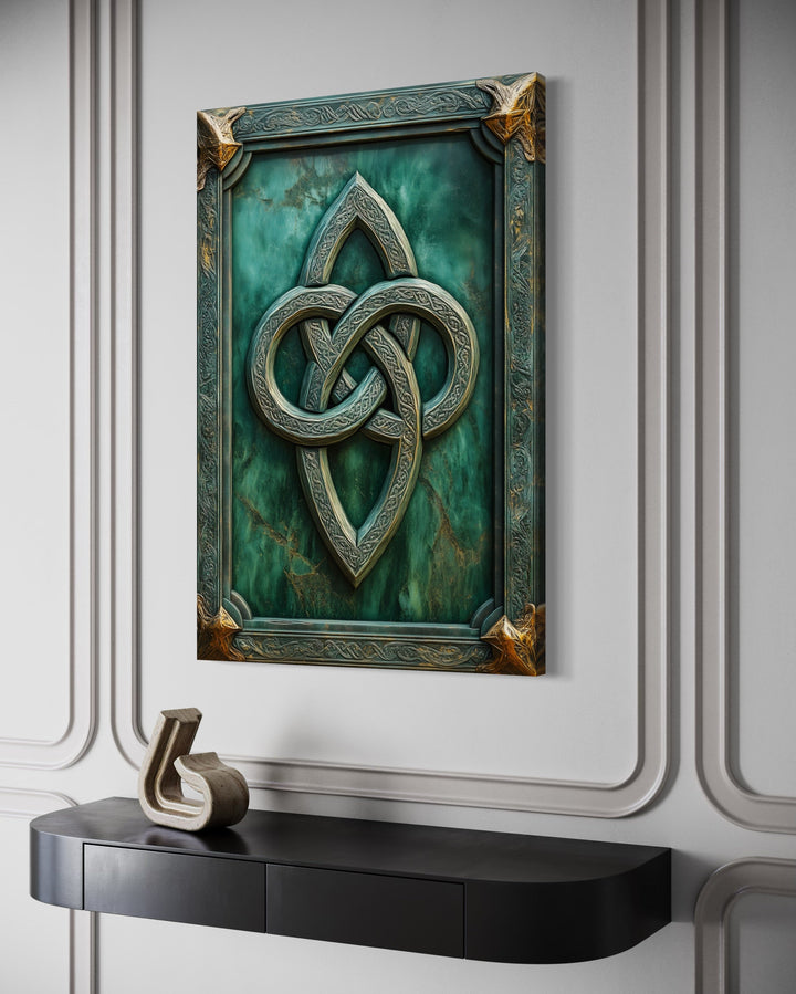 Antique Celtic Knot framed canvas wall art with green background and gold accents on a white wall.