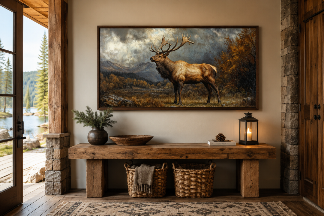 Antique elk in autumn mountains framed canvas wall art above a rustic wooden bench in a cabin.
