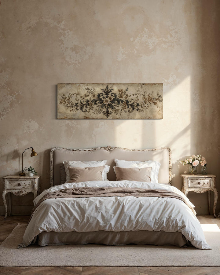 Antique neutral long narrow damask canvas wall art displayed above a bed in a rustic bedroom.