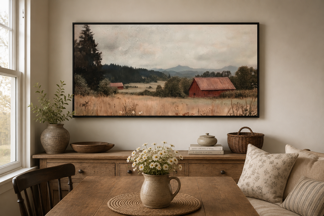 Framed antique red barn canvas print in a rustic farmhouse dining room setting.