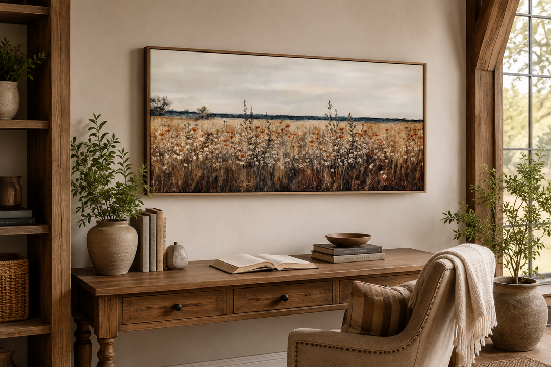 Antique rustic wildflowers field framed canvas wall art hanging above a wooden desk in a home office