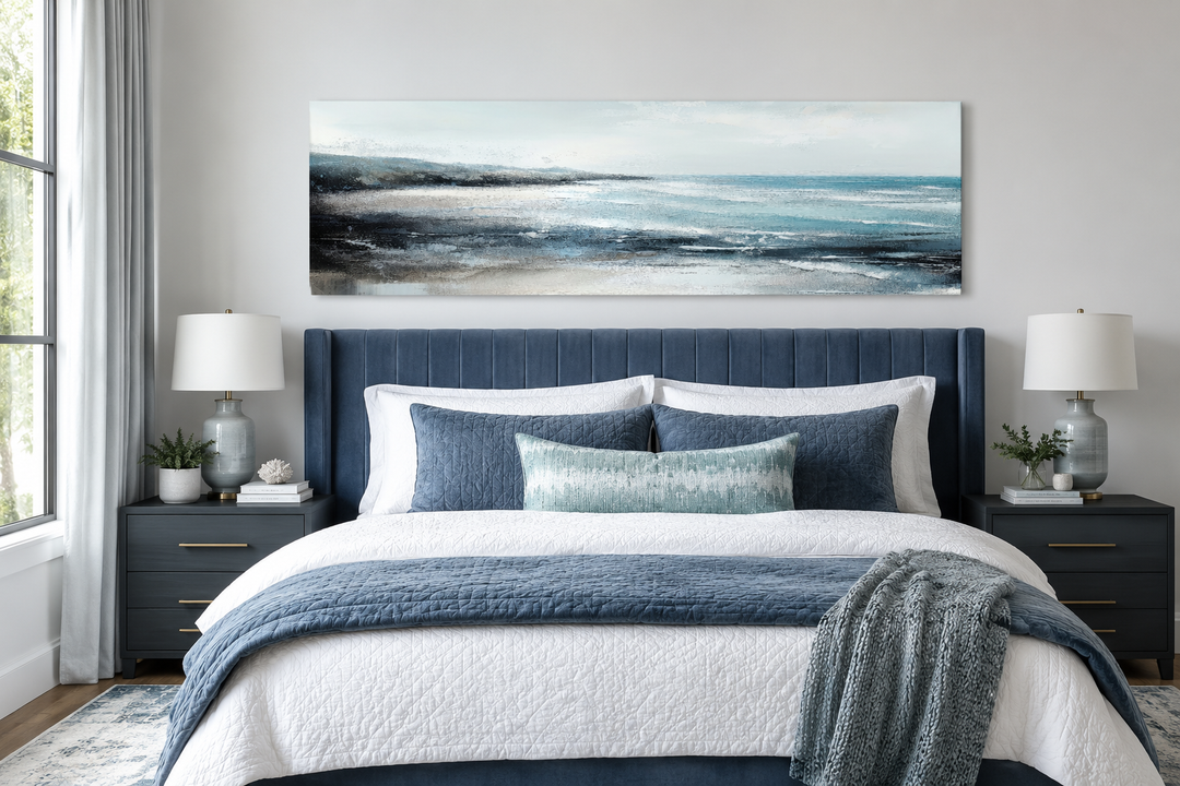 Aqua blue ocean beach coastal panoramic canvas wall art hanging over a bed in a modern bedroom.