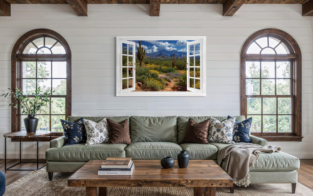Arizona desert and saguaro cactus fake window view wall art hanging in a rustic living room.