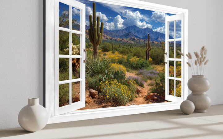 Arizona desert landscape with saguaro cacti seen through a white fake window frame wall art.