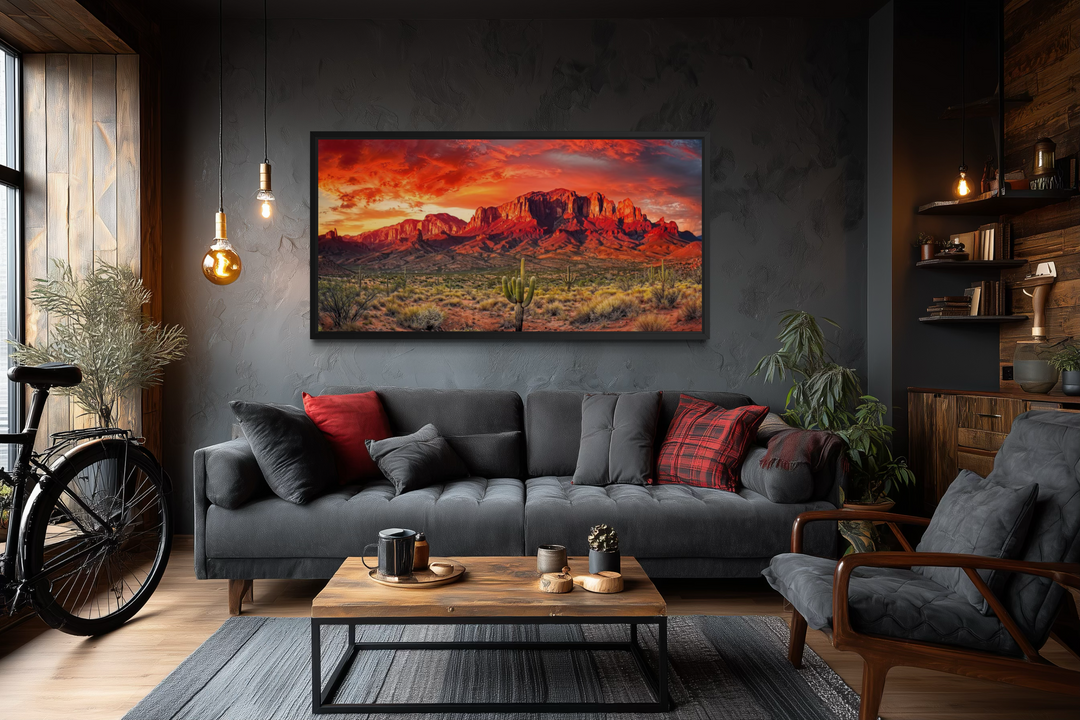 Arizona desert landscape at sunset framed canvas wall art hanging above a dark grey sofa.