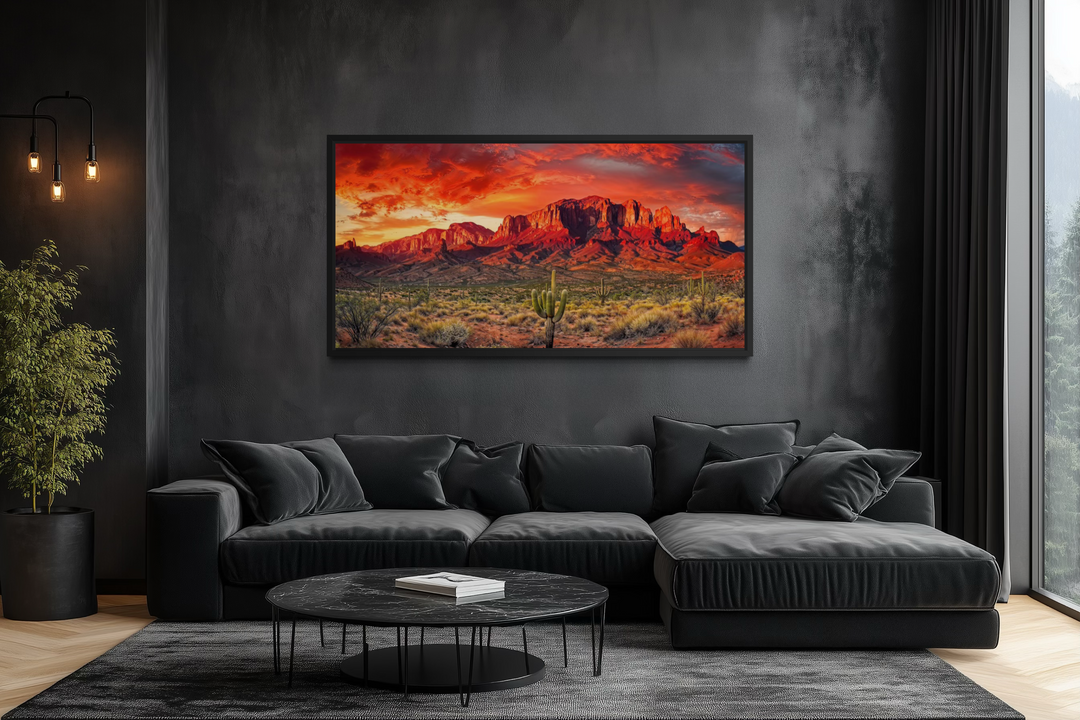 Arizona desert landscape at sunset framed canvas wall art above a black sofa in a modern room.