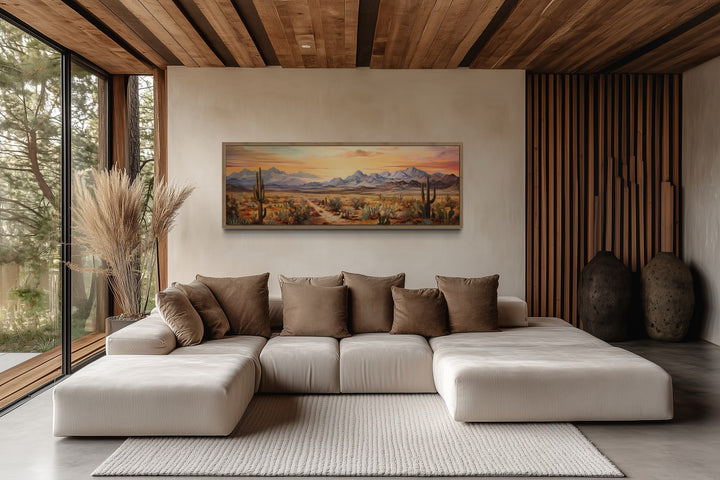 Arizona desert landscape at sunset long horizontal framed canvas wall art above a modern sofa.