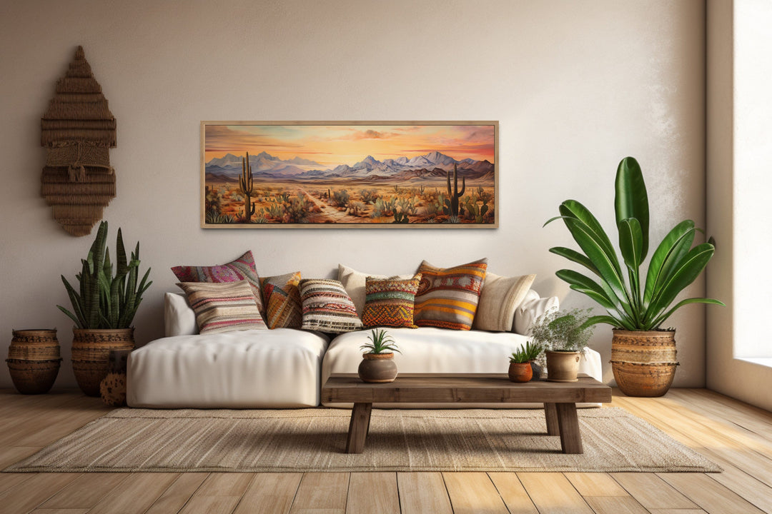 Arizona desert landscape at sunset long horizontal framed canvas wall art above a white sofa.
