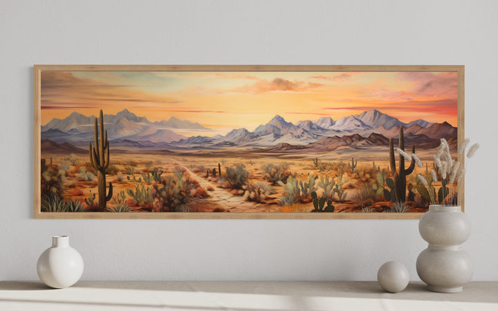 Long horizontal framed canvas art of an Arizona desert landscape with saguaro cacti at sunset.