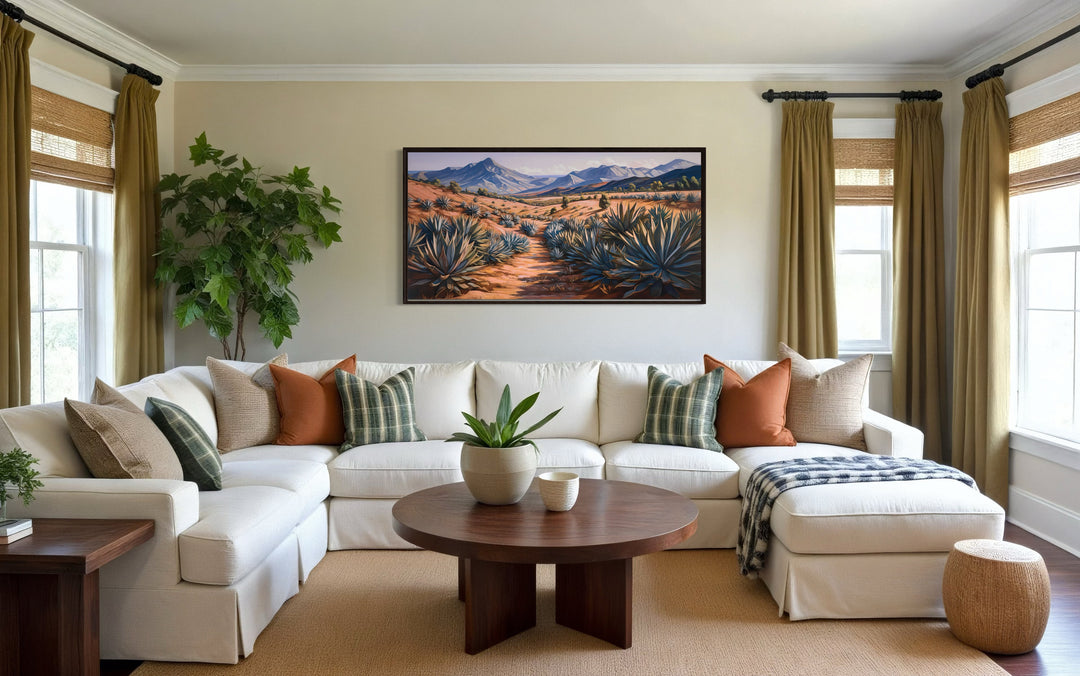 Arizona desert landscape with agave plants framed canvas wall art above a white sectional sofa.