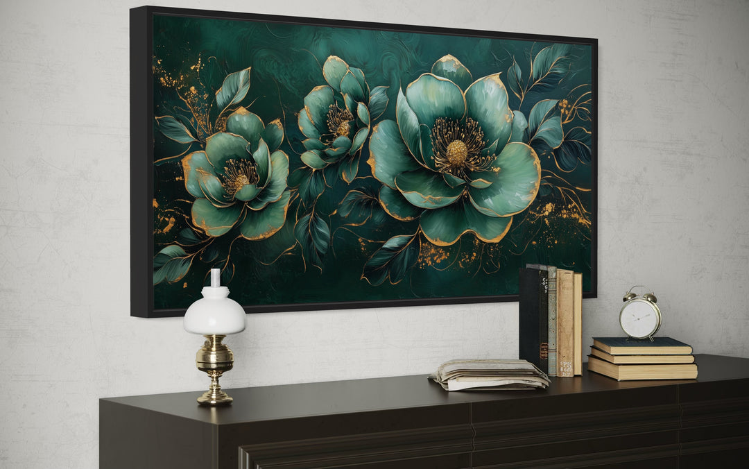 Art Nouveau emerald green and gold floral canvas print hanging above a dark wood sideboard.