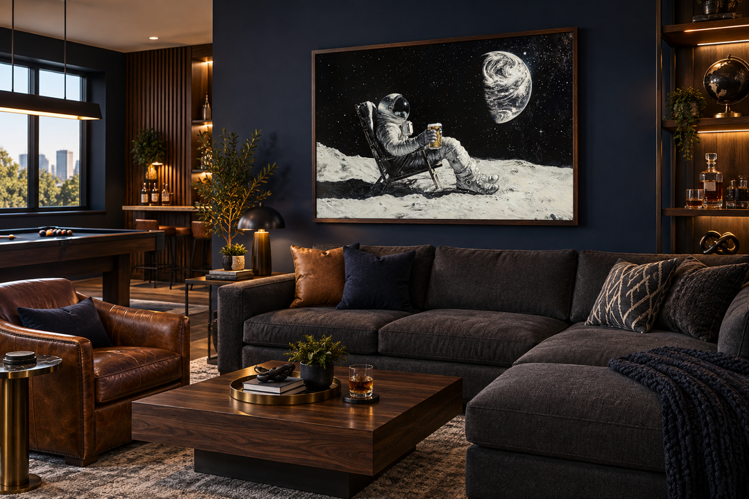 Framed canvas wall art of an astronaut drinking beer on the moon in a modern dark-toned living room.