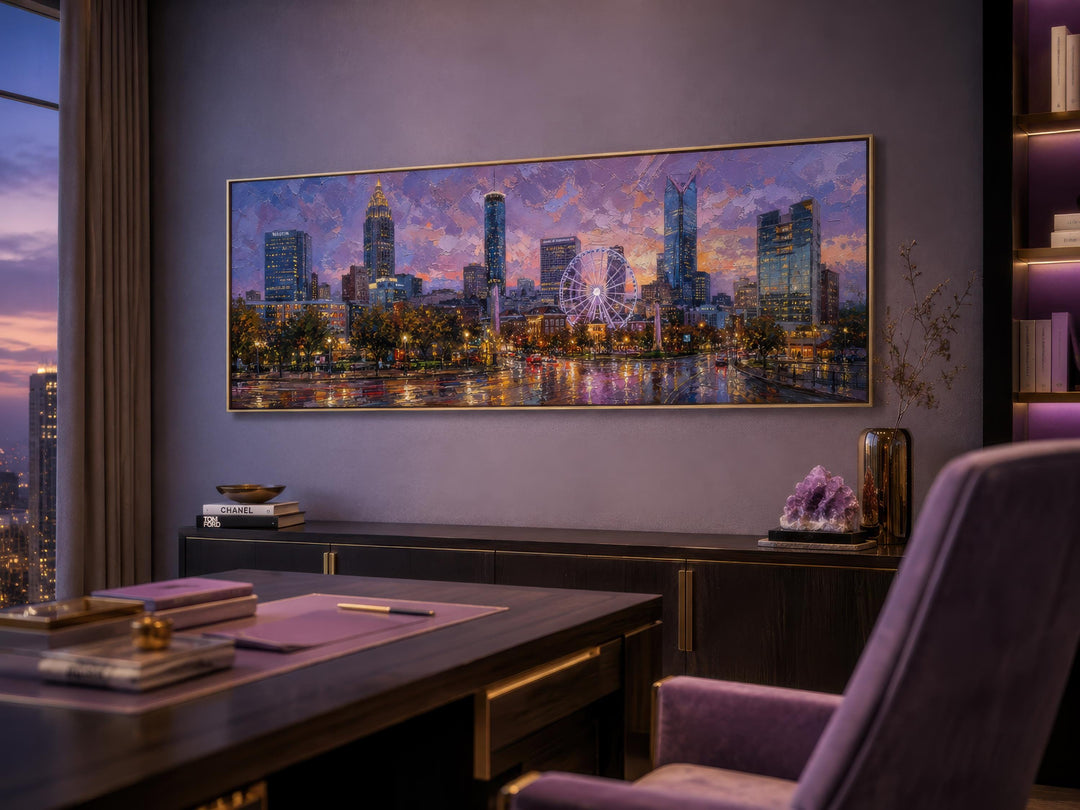 Panoramic Atlanta skyline canvas print at sunset displayed above a desk in a modern office.