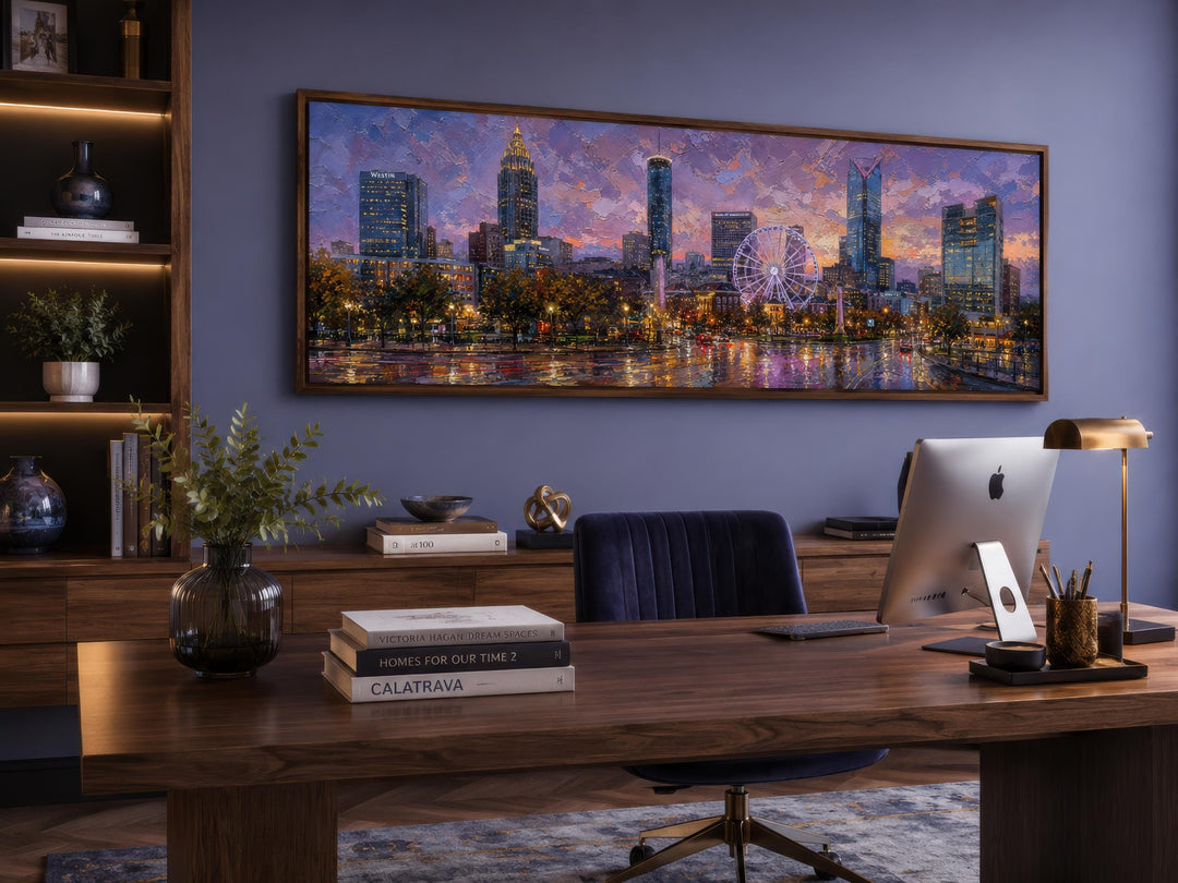 Panoramic Atlanta skyline canvas print featuring a sunset cityscape above a modern office desk.