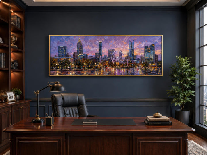 Panoramic Atlanta skyline canvas print at sunset hanging in a dark, sophisticated home office.