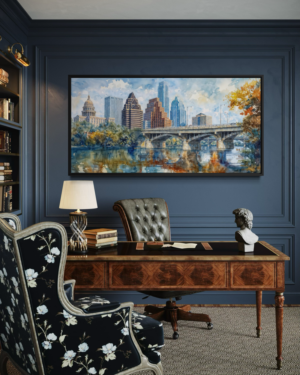 Framed watercolor canvas of the Austin skyline and bridge hanging in a sophisticated home office.