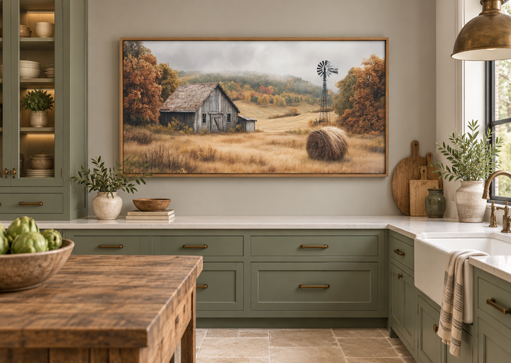 Rustic barn, hay bale, and windmill in a fall landscape canvas wall art in a green kitchen.