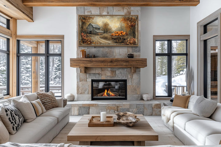 Autumn Barn and Pumpkin Cart farmhouse canvas wall art displayed above a stone fireplace.
