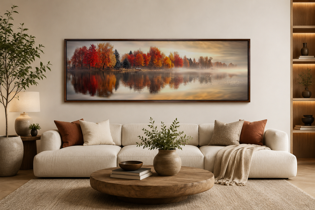 Autumn forest lake reflection long horizontal canvas wall art above a white sofa in a living room.