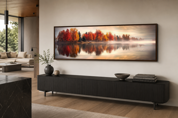 Autumn forest lake reflection long horizontal canvas wall art framed above a black sideboard.