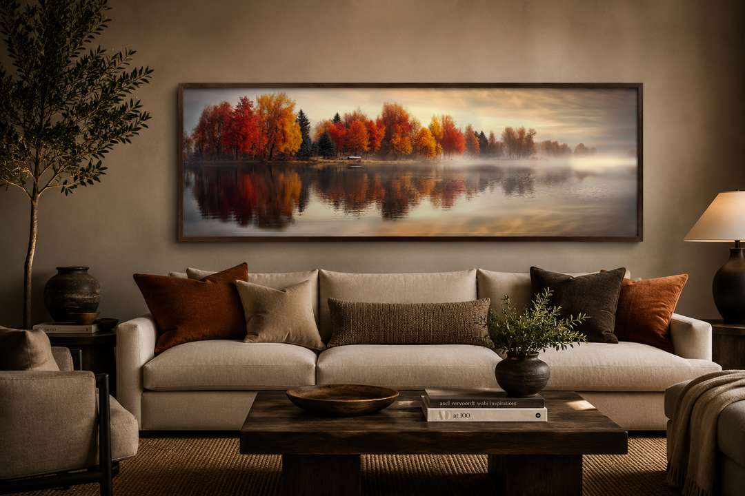 Autumn forest lake reflection long horizontal canvas wall art hanging above a neutral sofa.