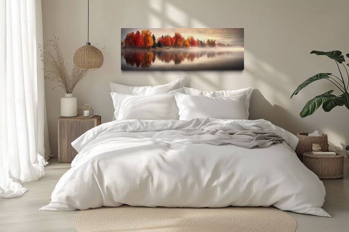 Autumn Forest Lake Reflection Long Horizontal Canvas Wall Art hanging above a white bed.
