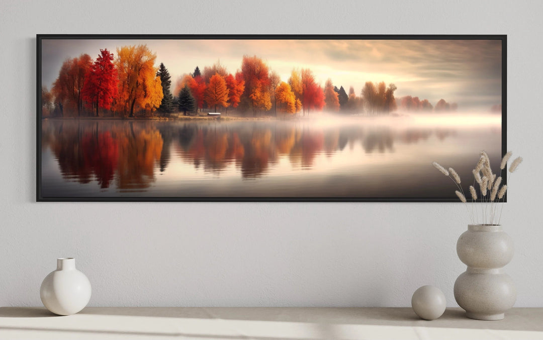 Autumn forest lake reflection long horizontal canvas wall art above a console with vases.