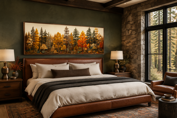 Long horizontal autumn forest painting on wood wall art hanging above a bed in a rustic cabin.