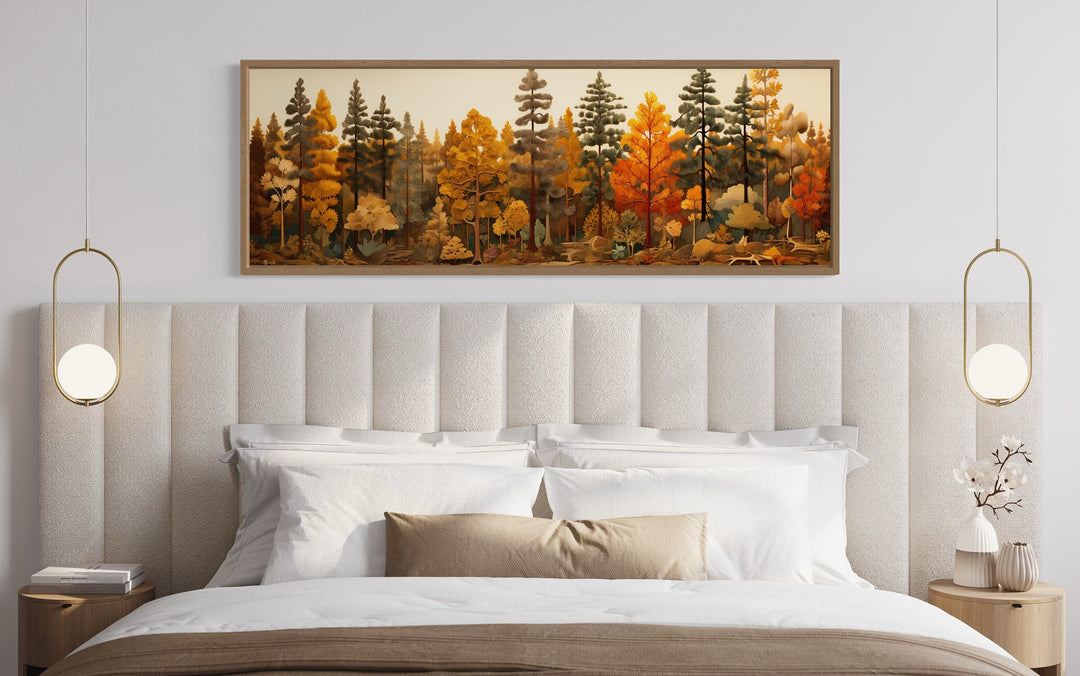 Long horizontal autumn forest painting on wood hanging above a bed in a rustic bedroom.