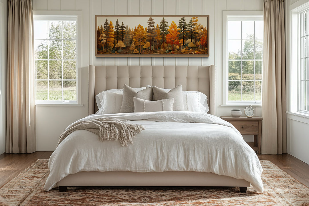 Autumn forest painting on wood, long horizontal wall art above a bed in a rustic bedroom.