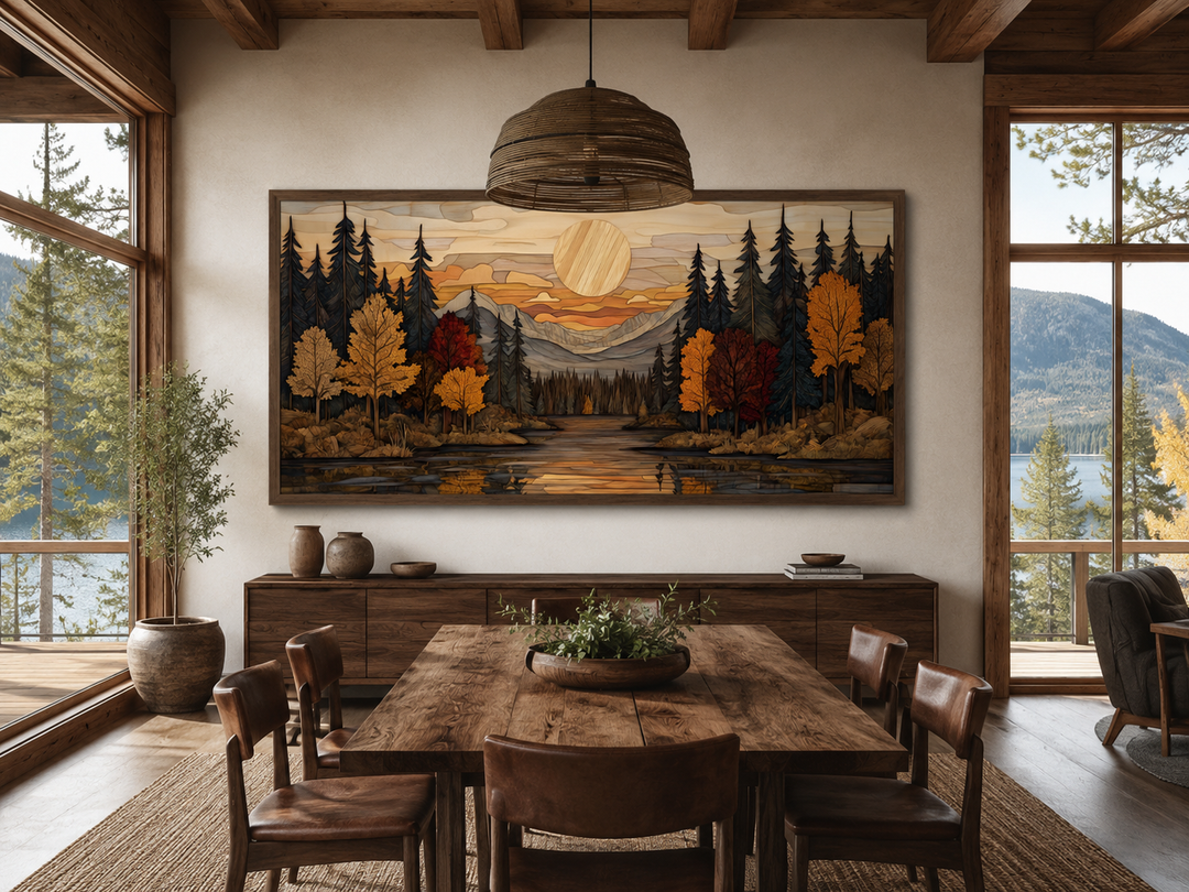 Autumn forest sunset rustic canvas wall art in a panoramic wood frame above a dining table.