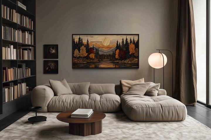 Autumn forest sunset rustic canvas wall art above a sofa in a cozy, modern living room.