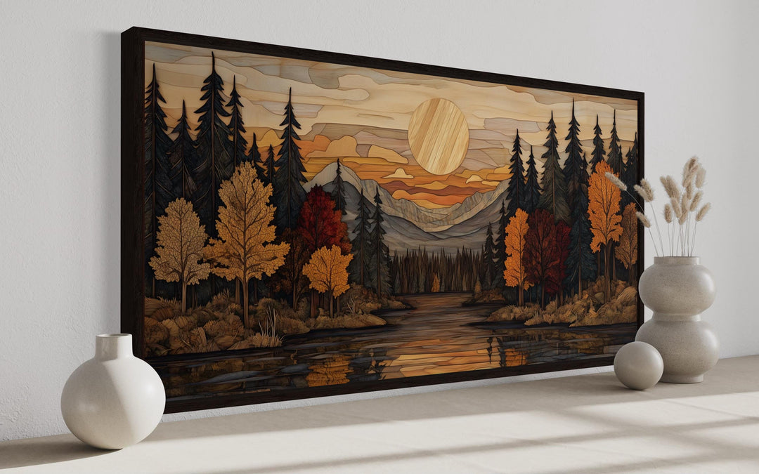 Panoramic rustic canvas wall art of an autumn forest sunset with mountains and a river.