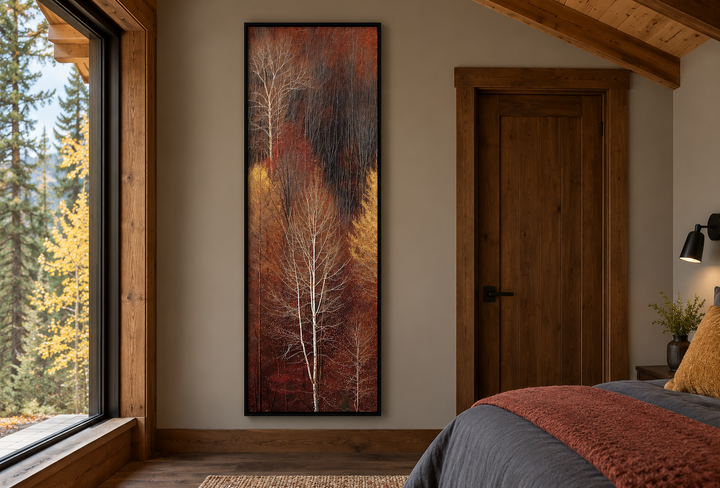Vertical tall narrow framed canvas wall art of an autumn forest with white birch trees.