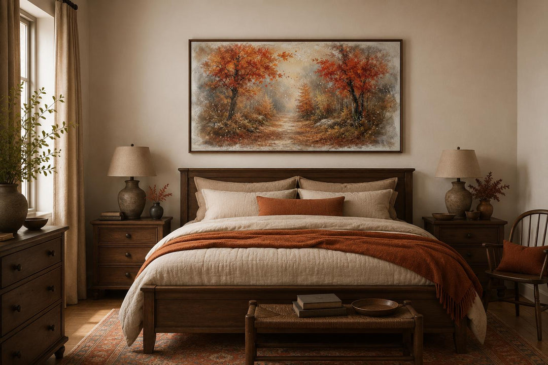 Autumn forest wall art with orange trees and misty woodland scene above a bed in a cozy bedroom.