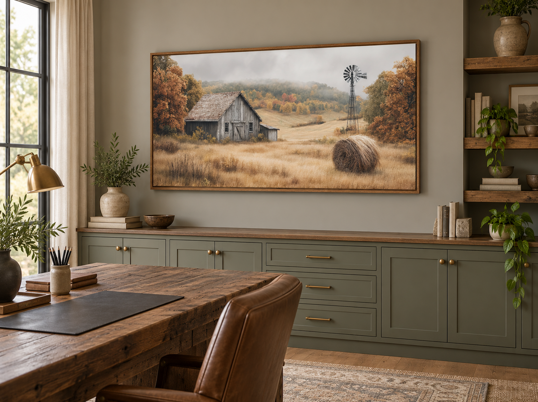 Rustic barn, hay bale, and windmill in a fall landscape canvas wall art in a home office setting.
