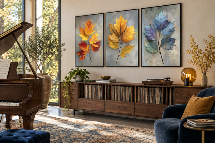 Set of 3 botanical wall art prints featuring colorful autumn leaves in orange, yellow, and blue.