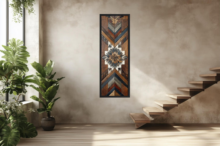 Tall narrow canvas wall art featuring a geometric Aztec-style wood mosaic pattern in earthy tones.