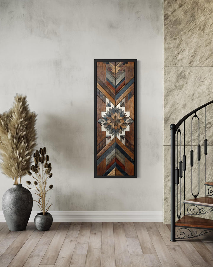Tall narrow canvas wall art featuring a geometric Aztec-style wood mosaic pattern.