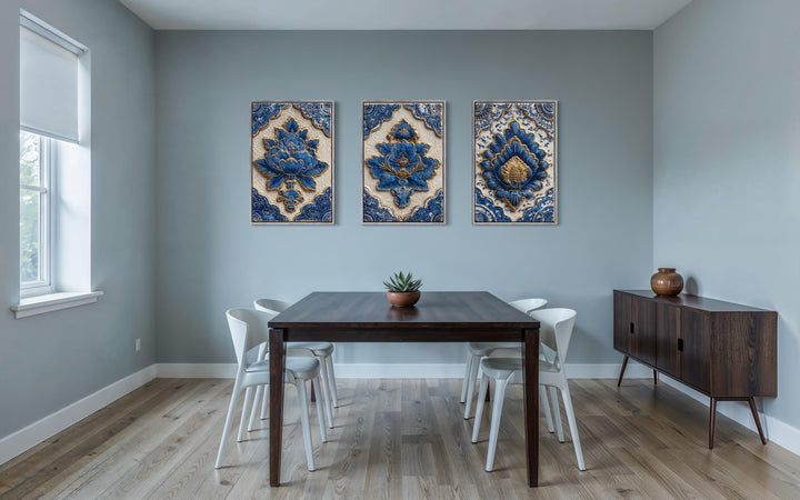 Set of three blue and gold azulejo tile canvas prints displayed in a modern dining room.